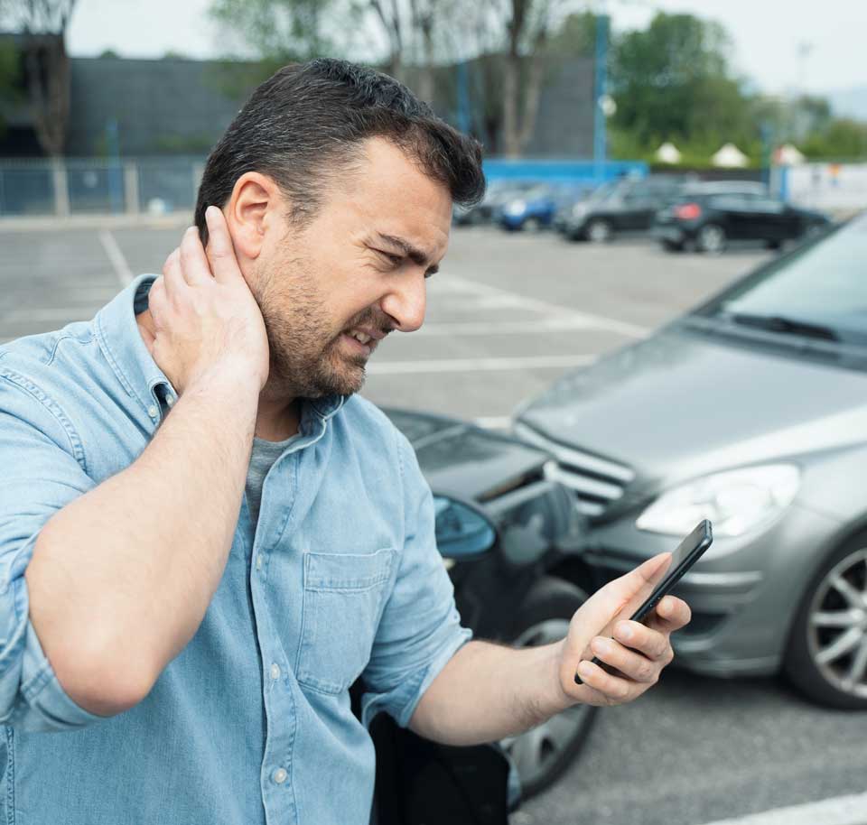 A man is experiencing a severe neck pain due to a car accident, he is in need of a car accident chiropractor in West Miami, Fl